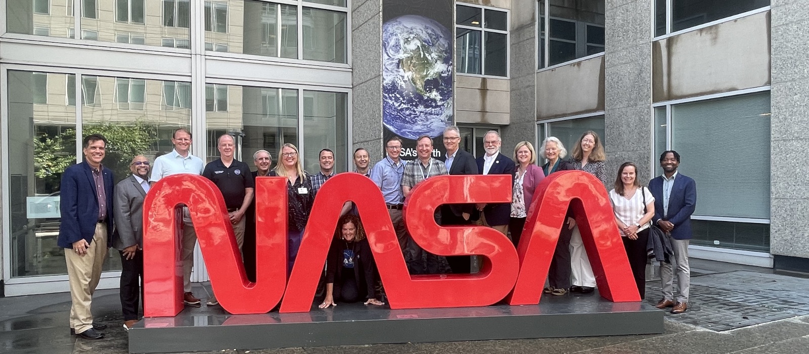 NASA OSTEM and Space Grant Directors in front of the Mary W. Jackson NASA Headquarters building.